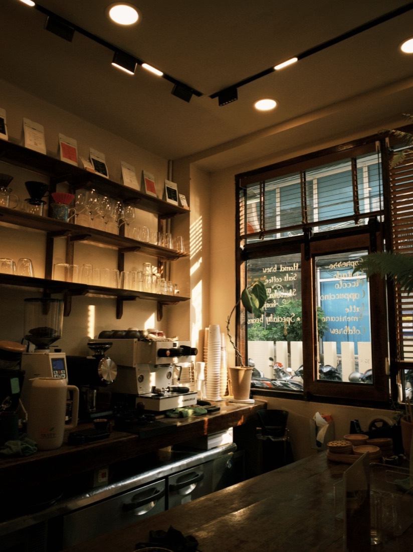 A warmly lit coffee shop interior